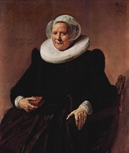 Portrait of a sitting, sixty year old woman with book in his right hand